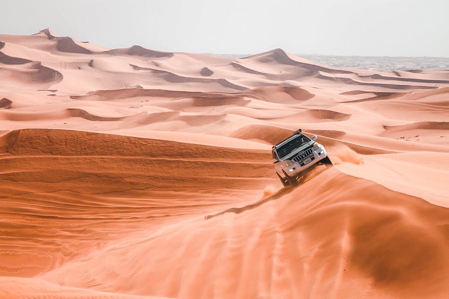 suv car driving in desert